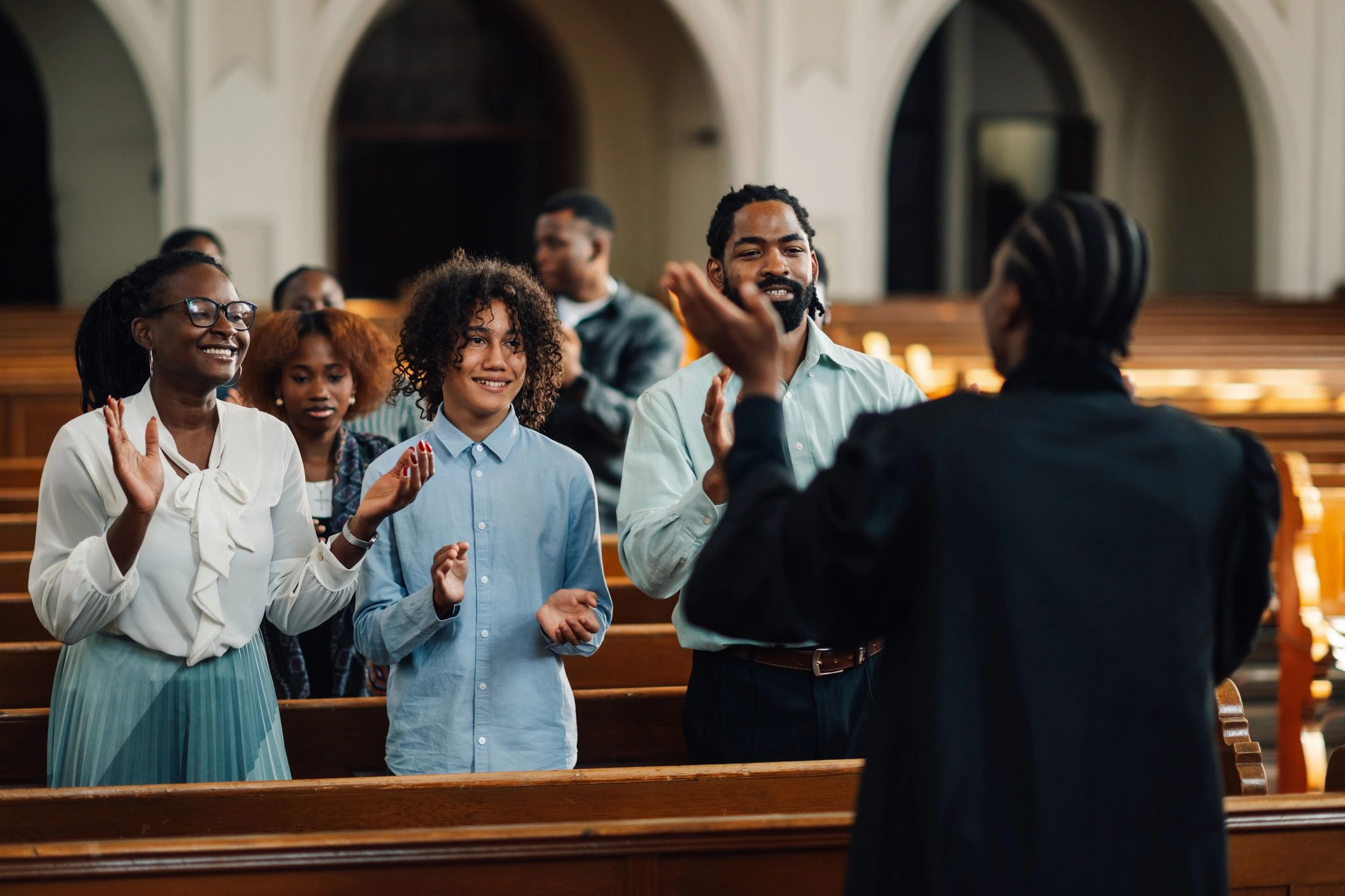 Congregation gathered in worship with joyful expressions